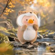 Lulu the Piggy Animal Party Otter blind box figure by forest stream, brown coat and curled tail visible.









