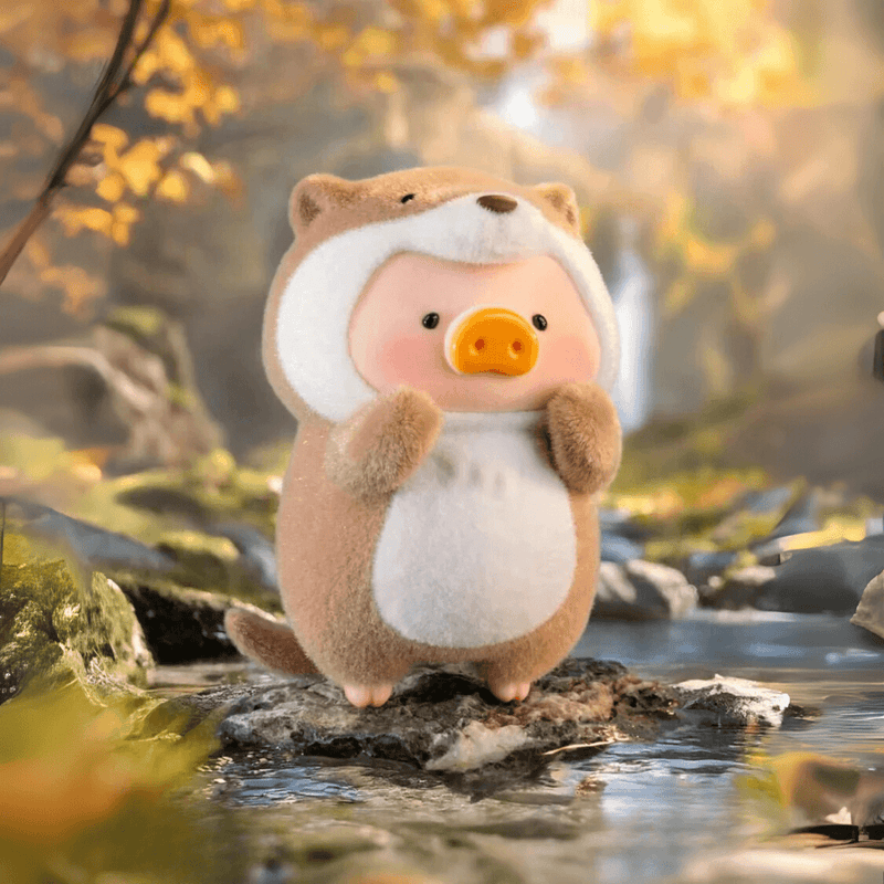 Lulu the Piggy Animal Party Otter blind box figure by forest stream, brown coat and curled tail visible.









