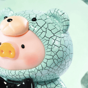 Close-up of Lulu the Piggy Teddy Mini 2 Ore Collection cracked turquoise style figure