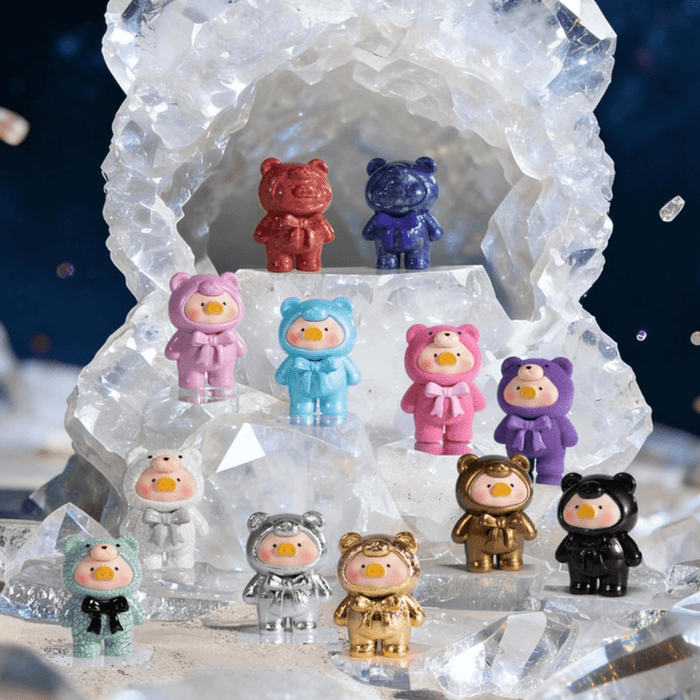 Lulu the Piggy Teddy Mini 2 Ore Collection mini figures displayed on crystal rocks