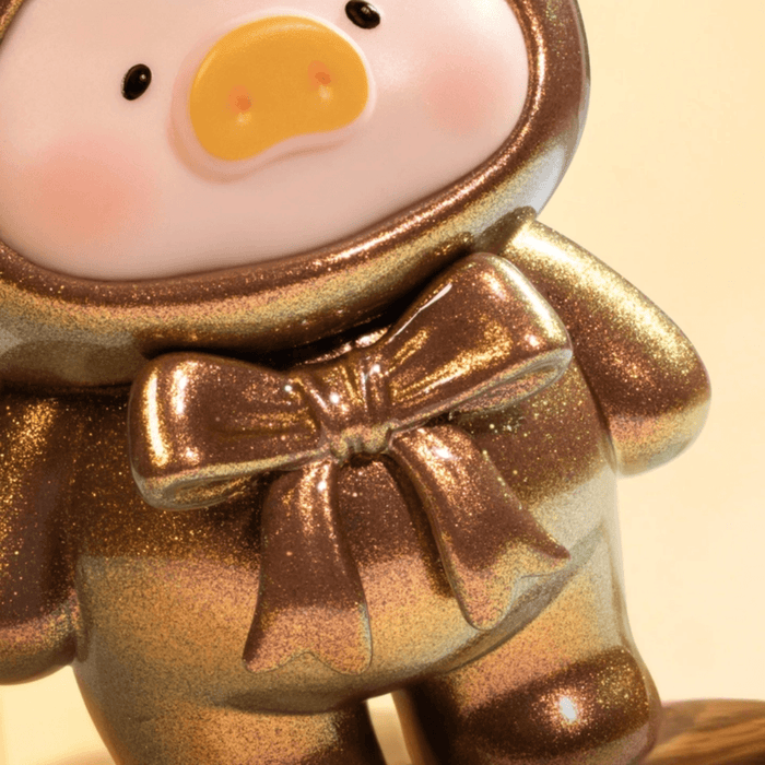 Close-up of Lulu the Piggy Teddy Mini 2 Ore Collection metallic bow detail