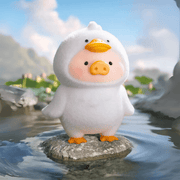 Lulu the Piggy Animal Party Duck blind box figure in white downy costume, balancing on river stone among lotus leaves.
