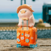 LuLu the Piggy's Travel Series Blind Box pig figure sitting on an orange suitcase with travel stickers