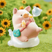 LuLu the Piggy's Travel Series Blind Box pig figure relaxing on a cloud seat with bubble blower and satchel bag