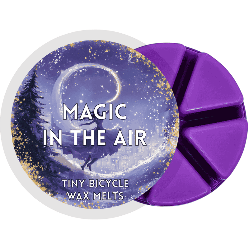 Purple Magic in the Air wax melt with enchanted winter scene of swirling snow and a dancing figure.