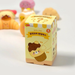 Malang Mozzi Bake Shop blind box packshot with dessert squishies blurred in the background