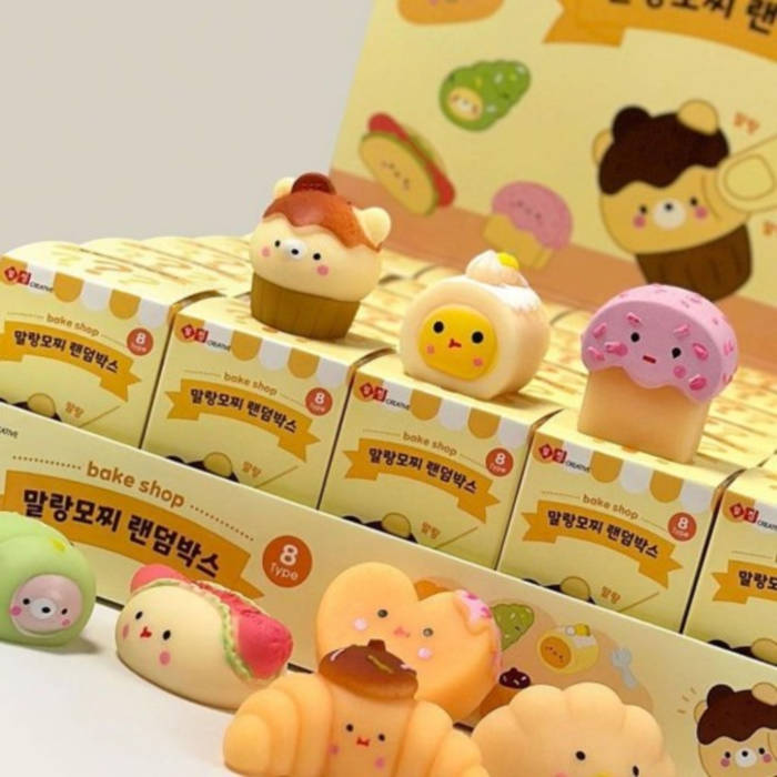 Close-up of Malang Mozzi Bake Shop blind boxes with three dessert mochi squishies on top