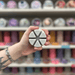 Mandarin and Sandalwood grey segmented wax melt held in hand