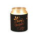 Black Merry Christmas sleeve used as a candle jar holder with lit jar inside