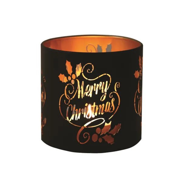 Round black and gold Merry Christmas tealight candle holder shown glowing