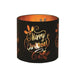 Round black and gold Merry Christmas tealight candle holder shown glowing