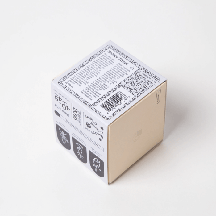 Bottom and side view of Milkjar Aurora candle box showing safety label and barcode.