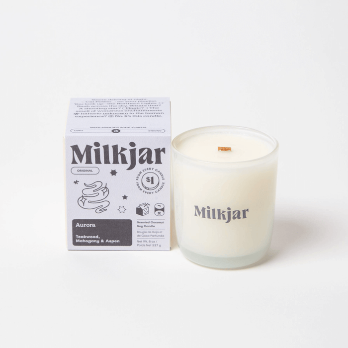 Milkjar Aurora coconut soy wax candle with matching box on a white background.
