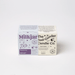 Milkjar Blueberry Tea candle box beside The Feel-Gooder Candle Co. packaging on a white background.