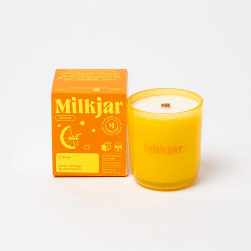 Milkjar Citrus Sweet Orange and Lemongrass candle with matching box on a white background.