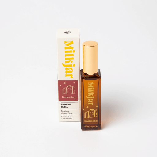 Milkjar Darjeeling Patchouli & Santal perfume roller 20ml pictured next to matching product box