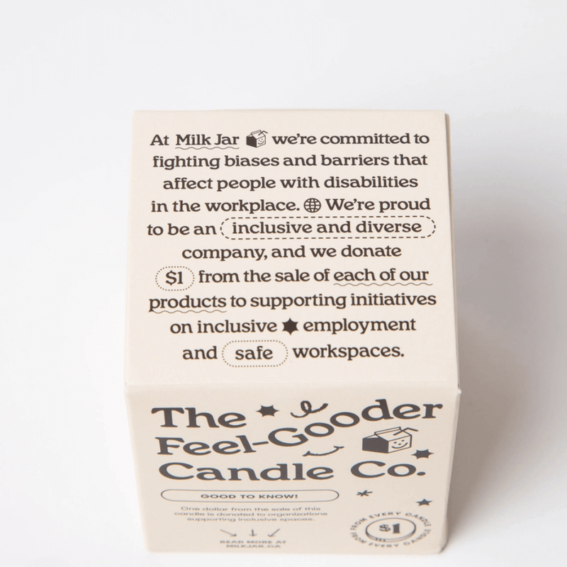 Back of The Feel-Good Candle Co box describing inclusive workplace support and $1 donation message.