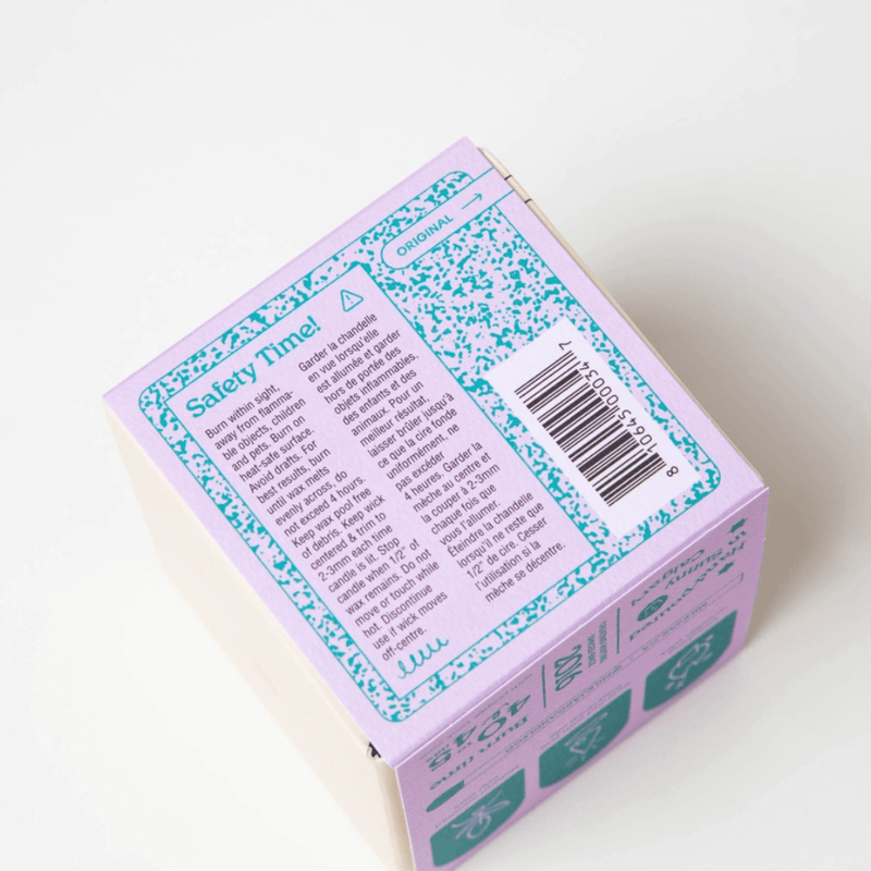 Top of Milkjar Hawaii candle box showing the safety label and barcode.