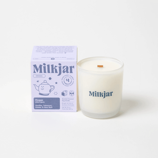 Milkjar Hygge coconut soy candle 8oz shown with the product box on a clean white background.