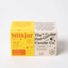 Milkjar Lemonade candle box next to The Feel-Good Candle Co box on a white background.
