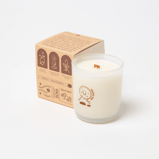 Milkjar Maple Dip candle with box angled behind, showing wooden wick, fragrance oil and coconut soy wax icons.