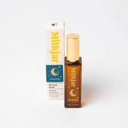 Milkjar Moonrise Neroli & Plum perfume roller 20ml pictured next to matching product box on white background