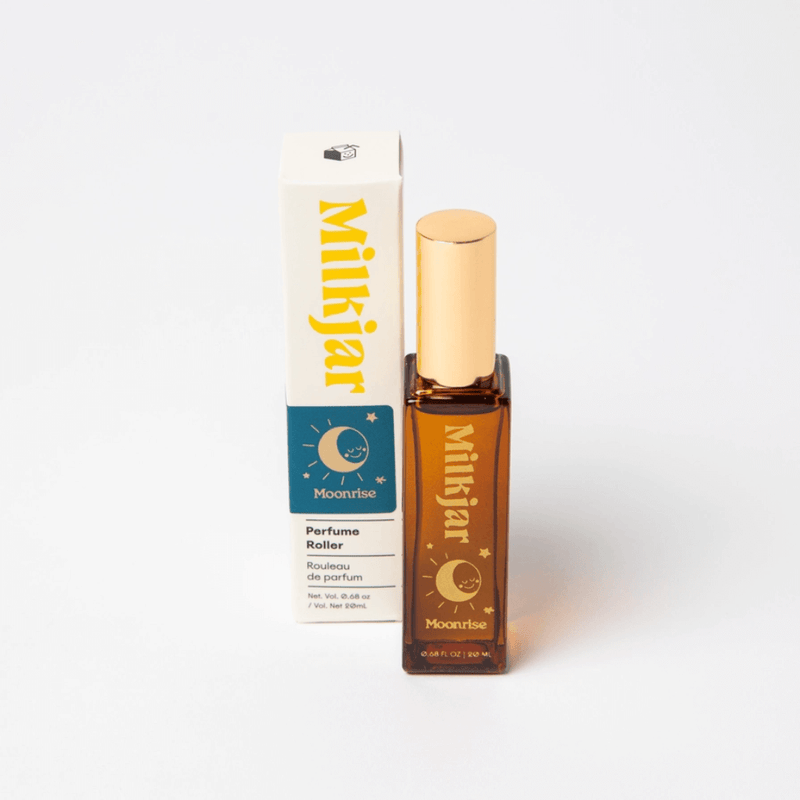 Milkjar Moonrise Neroli & Plum perfume roller 20ml pictured next to matching product box on white background
