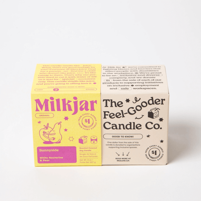 Milkjar Sunnyside candle box next to The Feel-Good Candle Co box on a white background.