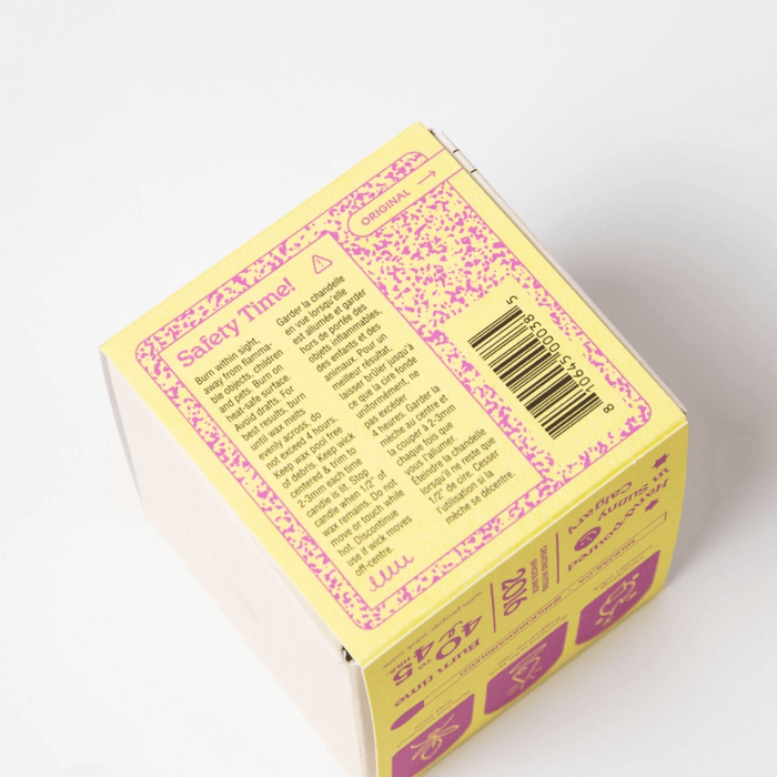 Top of Milkjar Sunnyside candle box showing safety label and barcode.