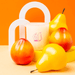Styled photo of Milkjar Sunnyside candle with pears and nectarines on a yellow set with orange background.