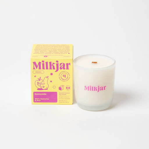 Milkjar Sunnyside white nectarine and pear candle with matching box on a white background.