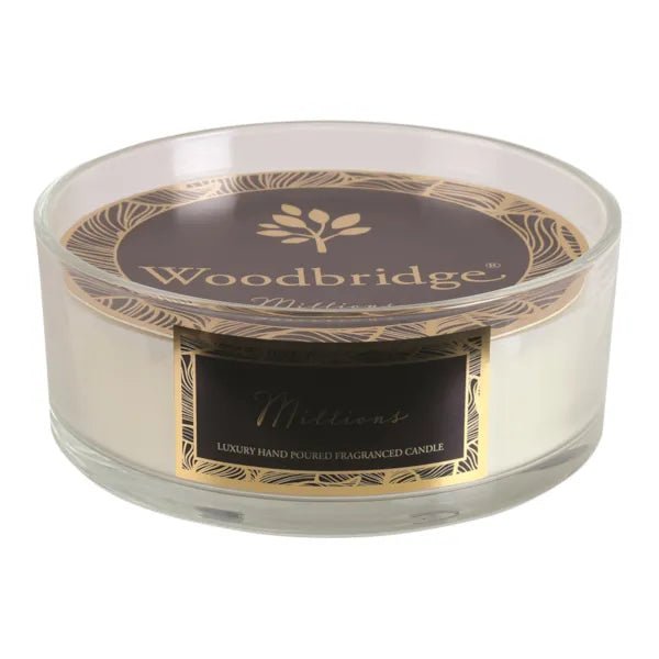 Millions 5 wick candle in clear round jar with luxe black and gold label

