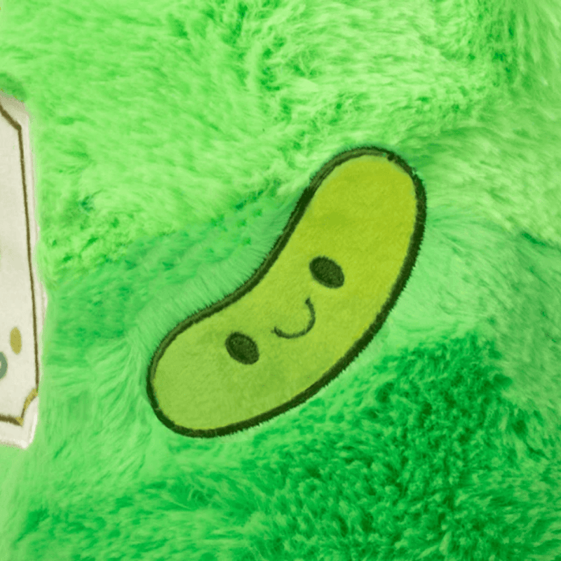 Close-up detail of the pickle decoration on the Mini Comfort Food Jar of Pickles plush toy
