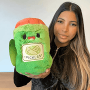 Mini Comfort Food Jar of Pickles plush toy being held for size comparison