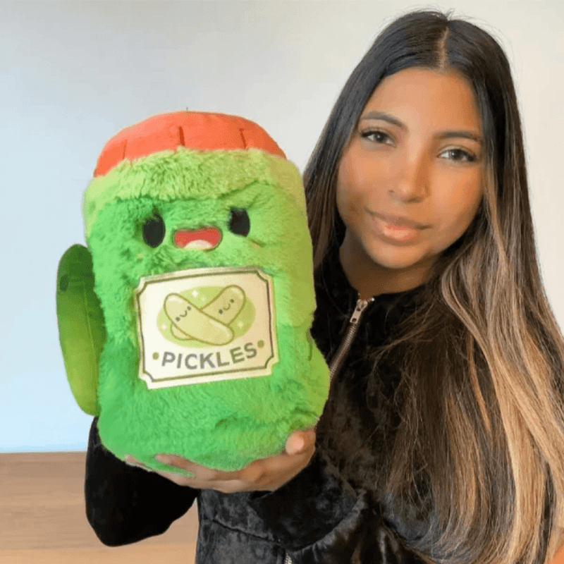 Mini Comfort Food Jar of Pickles plush toy being held for size comparison