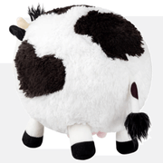 Back view of Squishable Mini Cow plush toy showing black and white fur and tail