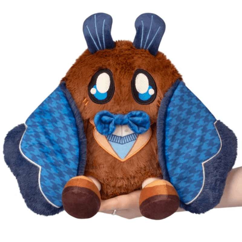 Mini Squishable Academia Mothman plush with a blue bow tie and houndstooth wings