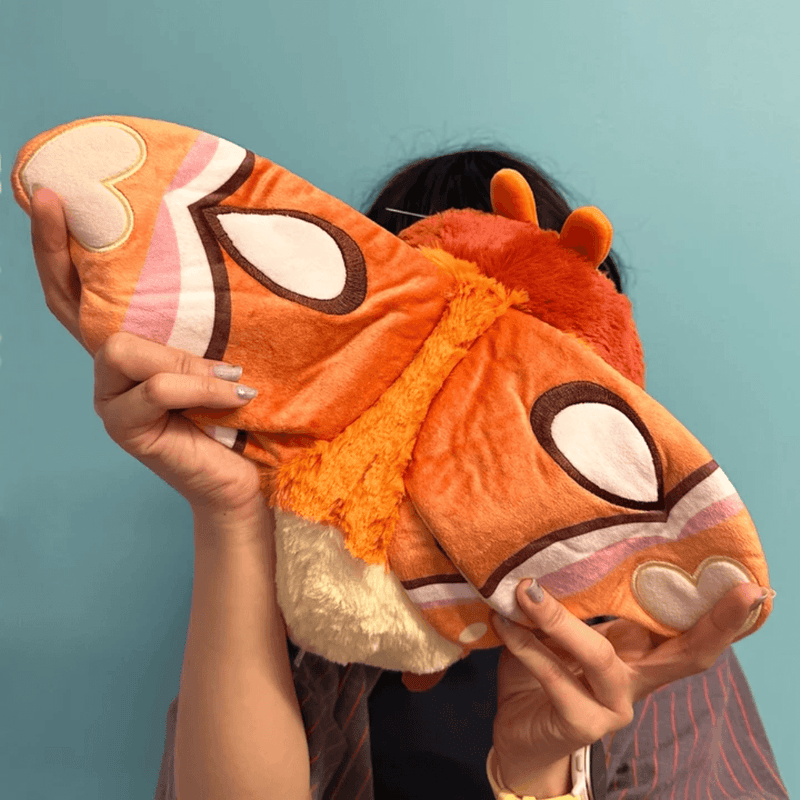 Patterned orange wings on the Mini Squishable Atlas Moth plush