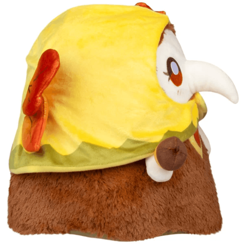 Side view of Autumn Fairy Plague Nurse Squishable plush showing yellow hood, autumn leaf wings and acorn