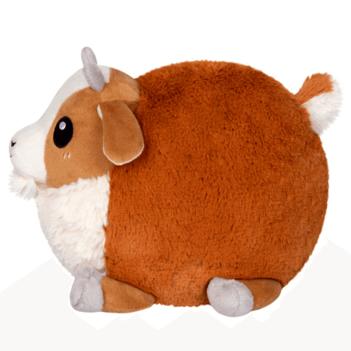 Side profile of Mini Squishable Baby Goat plush toy showing fluffy white chest and rounded body.