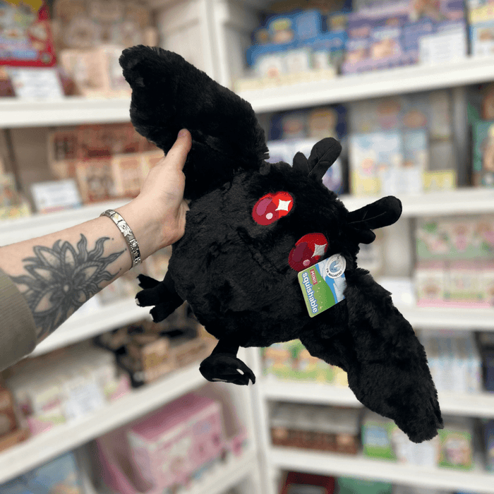 Mini Squishable Baby Mothman plushie with wings spread, red embroidered eyes and official Squishable tag
