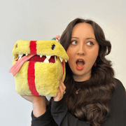 Mini Squishable Birthday Mimic Gift plush toy being held for size comparison