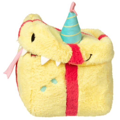 Side view of the Mini Squishable Birthday Mimic Gift soft toy showing yellow gift box shape and party hat

