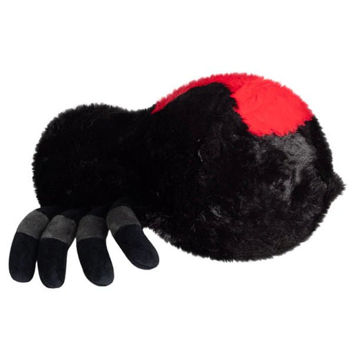 Side profile of Mini Squishable Black Widow plush toy with fuzzy black body and red back detail.