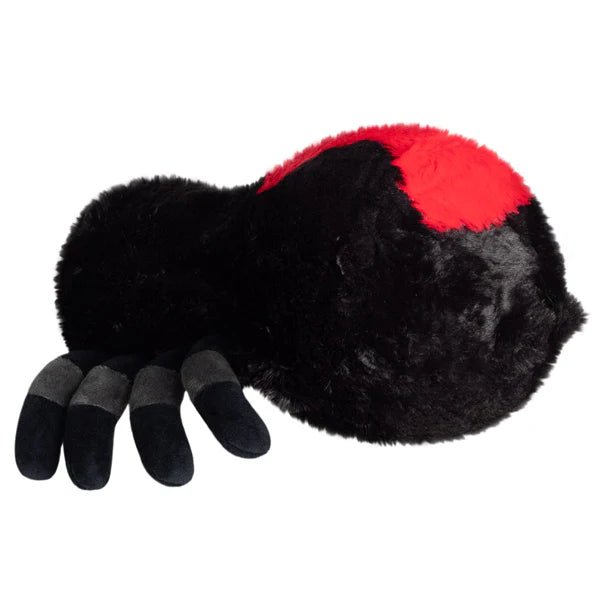 Side profile of Mini Squishable Black Widow plush toy with fuzzy black body and red back detail.