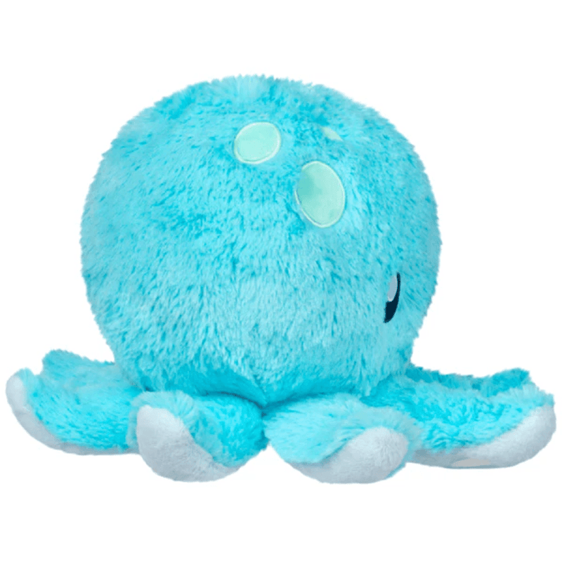 Side view showing the blue fur and tentacles of the Mini Squishable Baby Octopus