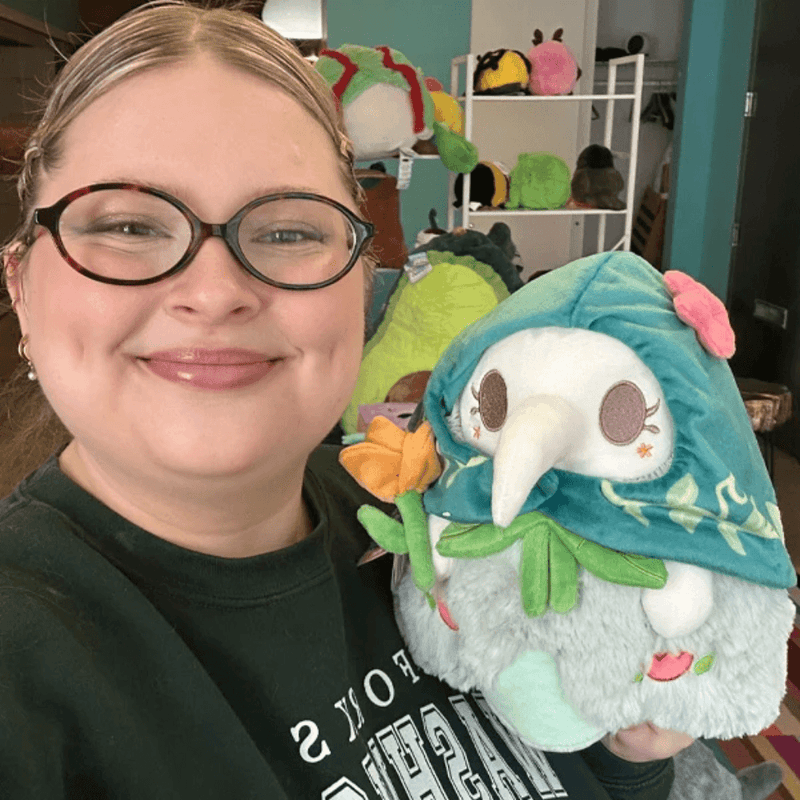 Mini Squishable Botanical Plague Nurse plush being held