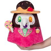 Front view of the Mini Squishable Candy Plague Doctor plush toy holding a lollipop