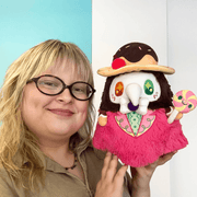 Person holding the Mini Squishable Candy Plague Doctor plush toy