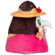 Side view of the Candy Plague Doctor plush showing its dessert hat and pink outfit